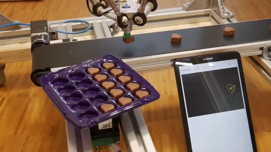 This delta robot is the ultimate chocolate praline packer, and it’s got some serious moves!